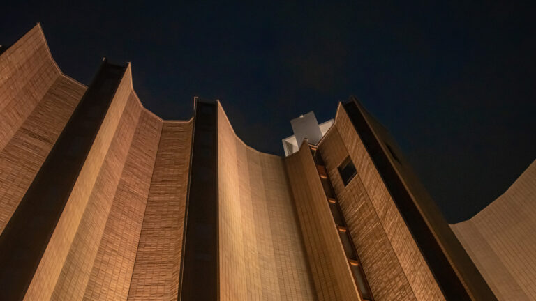 Kaleva Church illuminated at night with newly designed facade lighting by WhiteNight Lighting Oy, showcasing the textured architectural details