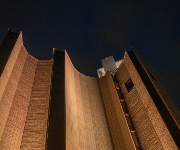 Kaleva Church illuminated at night with newly designed facade lighting by WhiteNight Lighting Oy, showcasing the textured architectural details